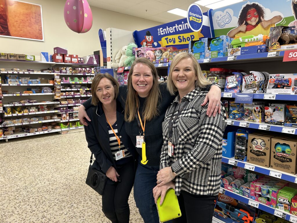 eXPD8 colleagues setting up The Entertainer in Tesco